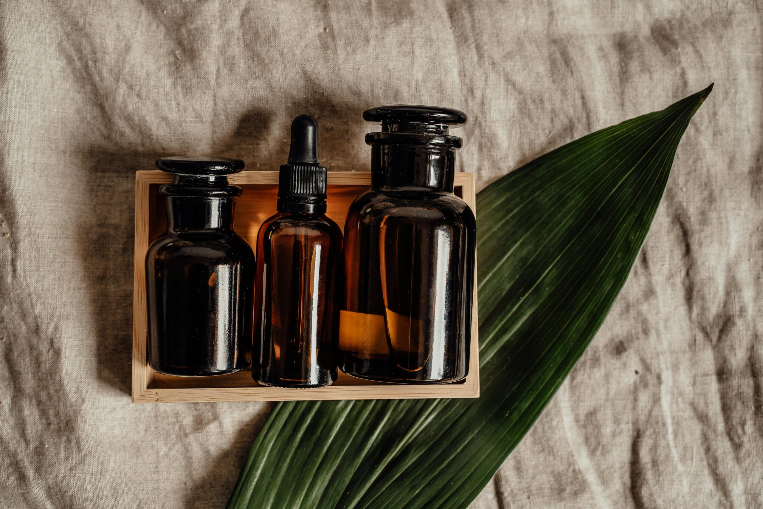 Set of Cosmetic Products in Brown Glass Bottles